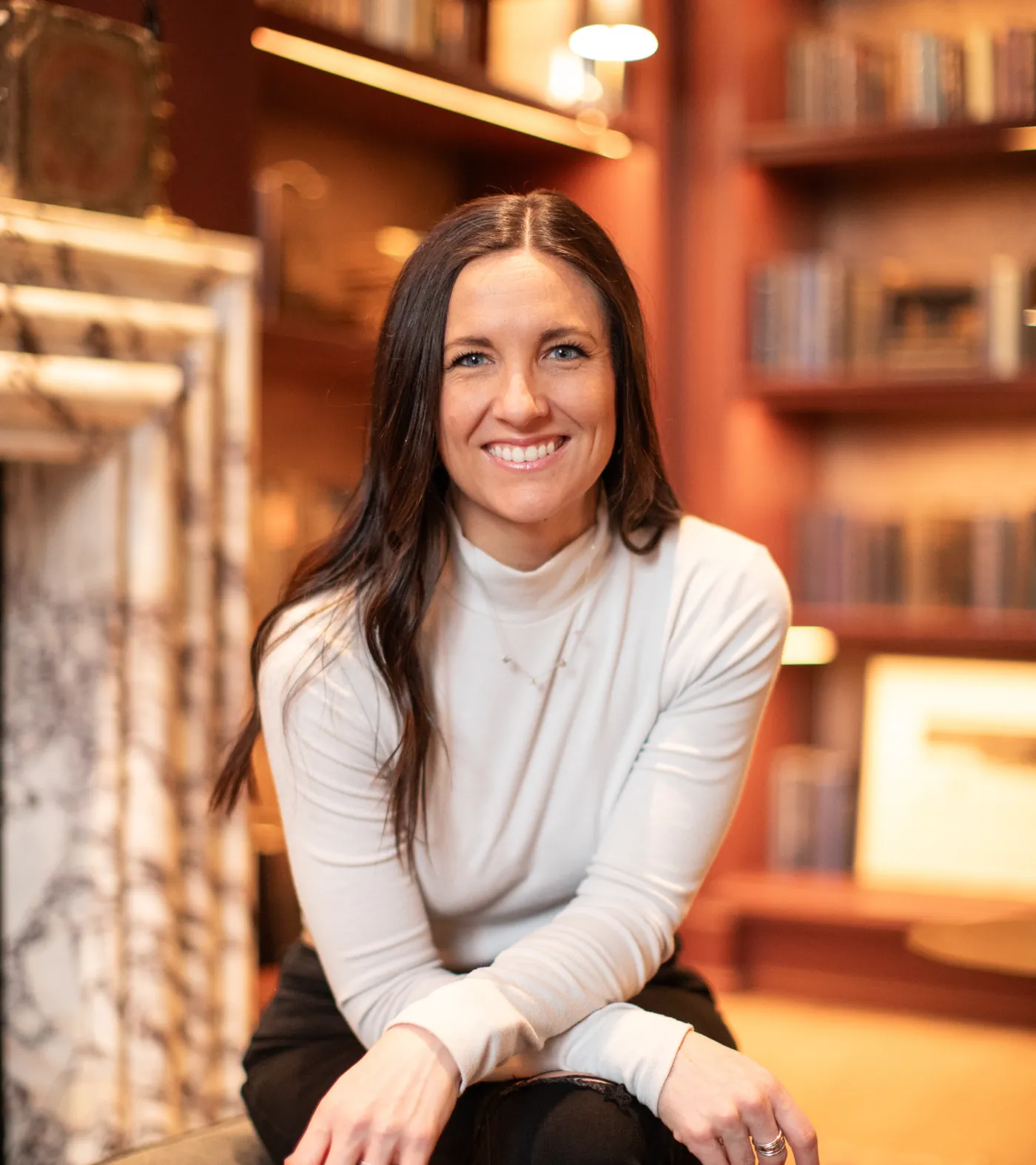 Mallory Robinson seated in a library