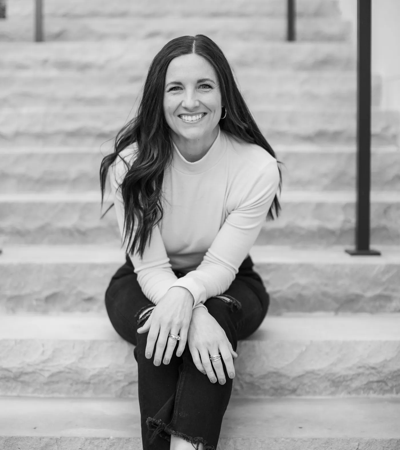 Mallory Robinson sitting on stone steps