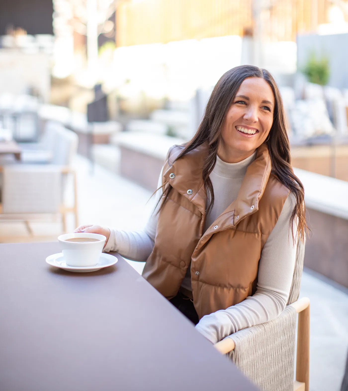 Mallory Robinson at a table with coffee